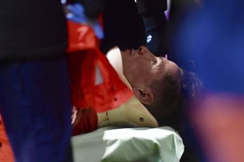 In this photo taken Thursday March 2, 2017, Atletico Madrid's Fernando Torres lies on a stretcher after getting injured during a La Liga soccer match at the Riazor stadium in La Coruna, Spain. Atletico Madrid says Torres has been released from the hospital Friday following a scary head-to-head clash which left him unconscious and that a CAT scan did not reveal any damage to his head or neck after knocking heads with Deportivo La Coruna midfielder Alex Bergantinos. (AP Photo/Carlos Pardellas)