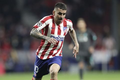 Atletico Madrid's Angel Correa runs for the ball during a first leg, round of 16, Champions League soccer match between Atletico Madrid and Liverpool at the Wanda Metropolitano stadium in Madrid, Spain, Tuesday Feb. 18, 2020. (AP Photo/Bernat Armangue)