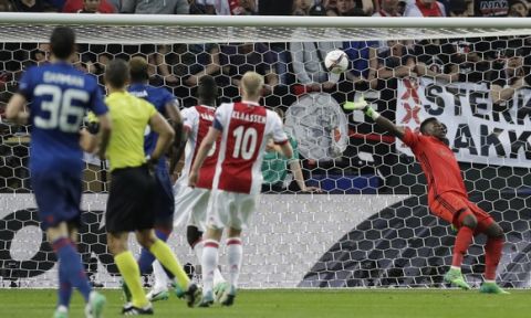 Ajax goalkeeper Andre Onana fails to make a save as Manchester's Paul Pogba scores the opening goal during the soccer Europa League final between Ajax Amsterdam and Manchester United at the Friends Arena in Stockholm, Sweden, Wednesday, May 24, 2017. (AP Photo/Michael Sohn)