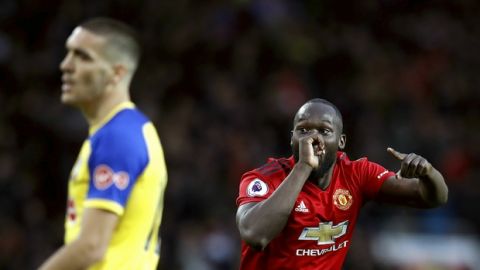 Manchester United's Romelu Lukaku, right, celebrates scoring his side's third goal of the game during the English Premier League soccer match between Manchester United and Southampton at Old Trafford, in Manchester, England, Saturday, March 2, 2019. (Martin Rickett/PA via AP)