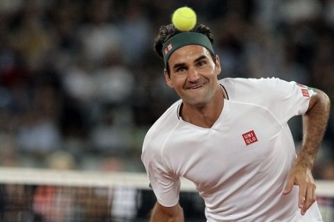Roger Federer in action during the exhibition tennis match against Rafael Nadal held at the Cape Town Stadium in Cape Town, South Africa, Friday Feb. 7, 2020. (AP Photo/Halden Krog)