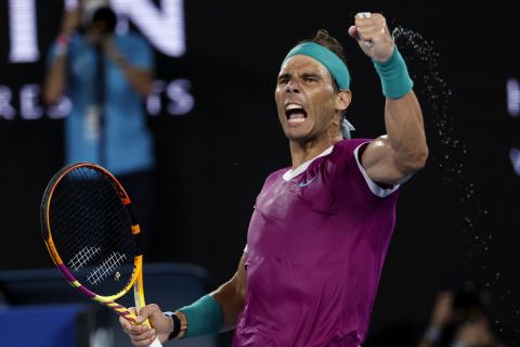 Rafael Nadal of Spain reacts after winning a point against Daniil Medvedev of Russia in the men's singles final at the Australian Open tennis championships in Melbourne, Australia, Sunday, Jan. 30, 2022.(AP Photo/Hamish Blair)