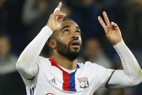 Lyon's Alexandre Lacazette celebrates scoring during the second leg semi final soccer match between Olympique Lyon and Ajax in the Stade de Lyon, Decines, France, Thursday, May 11, 2017. (AP Photo/Laurent Cipriani)