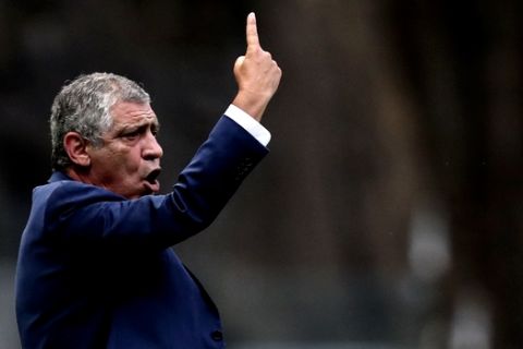Portugal coach Fernando Santos gestures during a friendly soccer match between Portugal and Tunisia in Braga, Portugal, Monday, May 28, 2018. (AP Photo/Luis Vieira)