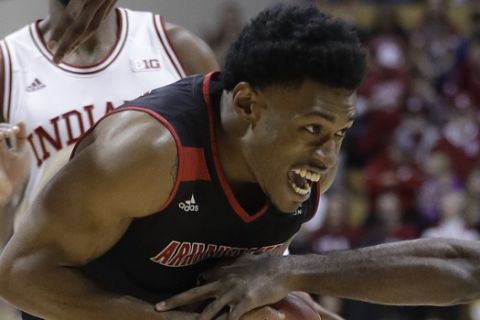 Arkansas State's Ty Cockfield is defended by Indiana's Josh Newkirk during the first half of an NCAA college basketball game, Wednesday, Nov. 22, 2017, in Bloomington, Ind. (AP Photo/Darron Cummings)
