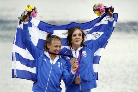 Greece's Alexandra Tsiavou, right, and Christina Giazitzidou celebrate after winning the bronze medal for the lightweight women's rowing double sculls in Eton Dorney, near Windsor, England, at the 2012 Summer Olympics, Saturday, Aug. 4, 2012. (AP Photo/Natacha Pisarenko)