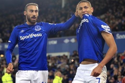 Everton's Richarlison, right, celebrates scoring his side's second goal of the game, during the League Cup, Fourth Round soccer match between Everton and Watford, at Goodison Park, in Liverpool, England, Tuesday, Oct. 29, 2019. (Simon Cooper/PA via AP)