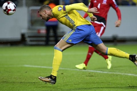 Sweden's Marcus Berg heads the ball to score during the World Cup 2018 group A qualifying match between Sweden and Luxembourg at Friends Arena in Solna, Stockholm, Saturday Oct. 7, 2017. (Soren Andersson/TT via AP)