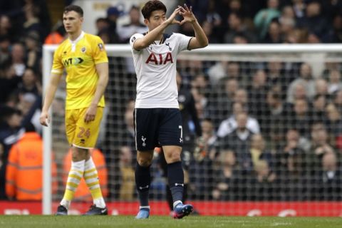 Tottenham's Heung-Min Son,center, celebrates after scoring his side's second goal during the English FA Cup quarterfinal soccer match between Tottenham Hotspur and Millwall FC at White Hart Lane stadium in London, Sunday, March 12, 2017. (AP Photo/Matt Dunham)