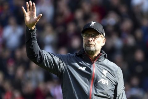 Liverpool's manager Jurgen Klopp waves to supporters at the end of the English Premier League soccer match between Sheffield United and Liverpool at Bramall Lane in Sheffield, England, Saturday, Sept. 28, 2019. (AP Photo/Rui Vieira)