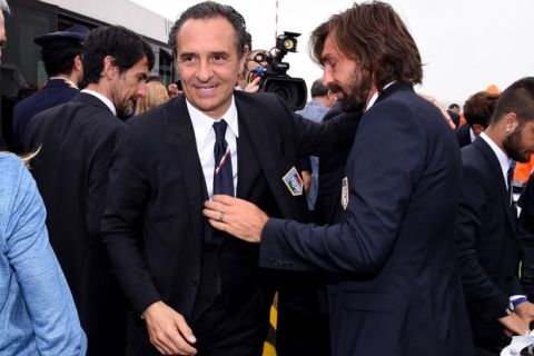 MILAN, ITALY - JUNE 26:  Head coach Italy Cesare Prandelli and Andrea Pirlo (R) arrive at Malpensa Airport on June 26, 2014 in Milan, Italy.  (Photo by Claudio Villa/Getty Images)