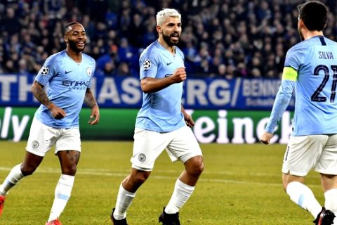 Manchester City forward Sergio Aguero, center, celebrates after scoring his side's opening goal during the first leg, round of sixteen, Champions League soccer match between Schalke 04 and Manchester City at Veltins Arena in Gelsenkirchen, Germany, Wednesday Feb. 20, 2019. (AP Photo/Martin Meissner)