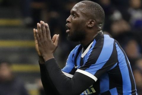 Inter Milan's Romelu Lukaku reacts after missing a chance to score during an Italian Cup soccer match between Inter Milan and Napoli at the San Siro stadium, in Milan, Italy, Wednesday, Feb. 12, 2020. (AP Photo/Luca Bruno)