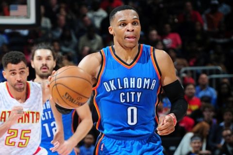 ATLANTA, GA - DECEMBER 5: Russell Westbrook #0 of the Oklahoma City Thunder handles the ball against the Atlanta Hawks on December 5, 2016 at Philips Arena in Atlanta, Georgia.  NOTE TO USER: User expressly acknowledges and agrees that, by downloading and/or using this Photograph, user is consenting to the terms and conditions of the Getty Images License Agreement. Mandatory Copyright Notice: Copyright 2016 NBAE (Photo by Scott Cunningham/NBAE via Getty Images)