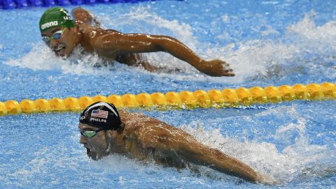 South Africa's Chad Le Clos, top, looks to United States' gold medal winner Michael Phelps in the men's 200-meter butterfly final during the swimming competitions at the 2016 Summer Olympics, Tuesday, Aug. 9, 2016, in Rio de Janeiro, Brazil. (AP Photo/Martin Meissner)