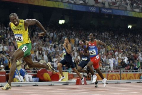 Jamaica's Usain Bolt crosses the finish line to win the gold in the men's 200-meter final during the athletics competitions in the National Stadium at the Beijing 2008 Olympics in Beijing, Wednesday, Aug. 20, 2008. (AP Photo/David Phillip)