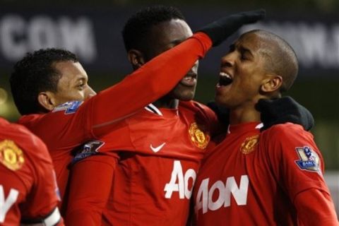 Manchester United's Ashley Young, right, celebrates his goal during the English Premier League soccer match between Tottenham Hotspur and Manchester United at White Hart Lane Stadium in London, Sunday, March 4, 2012. (AP Photo/Kirsty Wigglesworth) 