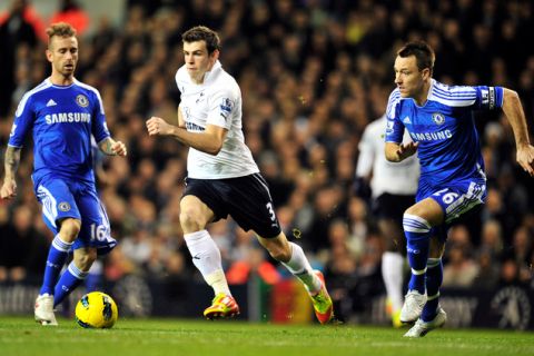 Tottenham Hotspur's Welsh defender Gareth Bale (C) vies with Chelsea's English defender John Terry (R) during an English Premier League football match against Chelsea at White Hart Lane in London, on December 22, 2011. AFP PHOTO/GLYN KIRK  
                                                                                                             
RESTRICTED TO EDITORIAL USE. No use with unauthorized audio, video, data, fixture lists, club/league logos or "live" services. Online in-match use limited to 45 images, no video emulation. No use in betting, games or single club/league/player publications. (Photo credit should read GLYN KIRK/AFP/Getty Images)