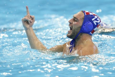 Paulo Obradovic of Croatia reacts after scoring a goal against Italy during their men's water polo preliminary round match at the 2012 Summer Olympics, Thursday, Aug. 2, 2012, in London. (AP Photo/Alastair Grant)