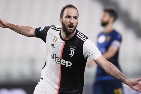 Juventus' Gonzalo Higuain celebrates after a goal during the Serie A soccer match between Juventus and Lecce, at the Allianz Stadium in Turin, Italy, Friday, June 26, 2020. (Fabio Ferrari/LaPresse via AP)
