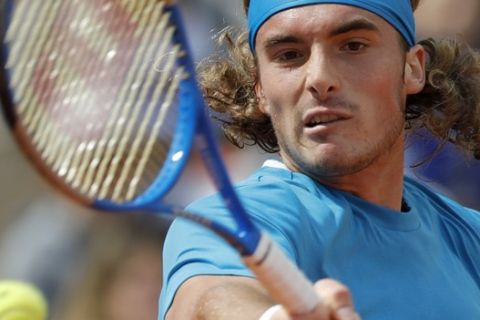 Greece's Stefanos Tsitsipas plays a shot against Bolivia's Hugo Dellien during their second round match of the French Open tennis tournament at the Roland Garros stadium in Paris, Wednesday, May 29, 2019. (AP Photo/Pavel Golovkin)