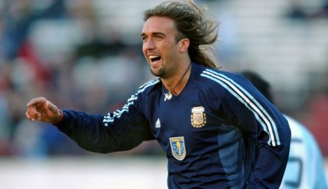 ** FILE ** Argentine striker Gabriel Batistuta celebrates a goal during a game in Buenos Aires, Argentina July 9, 2003 to commemorate the 25th anniversary of the World Cup won in 1978. Plagued by knee injuries, he released a statement Sunday March 13, 2005 saying he is retiring, a day after ending his contract prematurely with Al-Arabi, where he moved in 2003.  Batistuta, who retired from Argentina's national team three years ago, played on World Cup teams in 1994, '98, and 2002. He also led Argentina to Copa America titles in 1991 and '93. (AP Photo/Daniel Luna) ** EFE OUT **