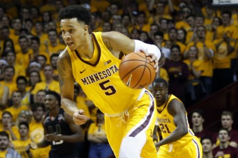 Minnesota's Amir Coffey plays against Miami in the first half of an NCAA college basketball game Wednesday, Nov. 29, 2017, in Minneapolis. (AP Photo/Jim Mone)