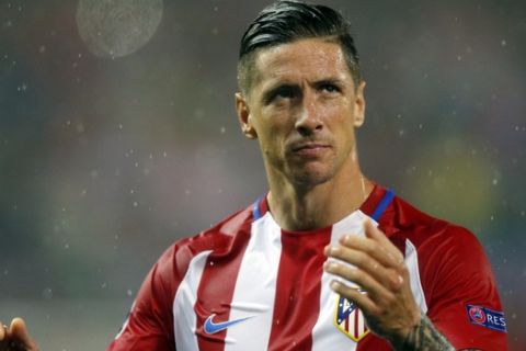 FILE - In this Wednesday, May 10, 2017 file photo, Atletico's Fernando Torres looks dejected at the end of a Champions League semifinal, 2nd leg soccer match between Atletico de Madrid and Real Madrid, in Madrid, Spain. Coach Diego Simeone, a longtime supporter of the Fernando Torres, said Wednesday Feb. 22, 2018, he will not go out of his way to try to keep Torres at Atletico going forward. (AP Photo/Daniel Ochoa de Olza, File)