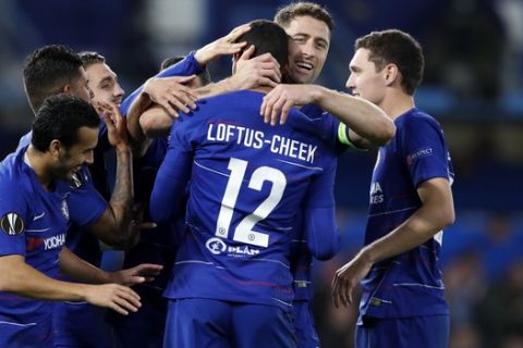 Chelsea's Ruben Loftus-Cheek, center, celebrates with teammates after scoring his side's third goal during a Group L Europa League soccer match between Chelsea and BATE at Stamford Bridge stadium in London, Thursday, Oct. 25, 2018. (AP Photo/Alastair Grant)