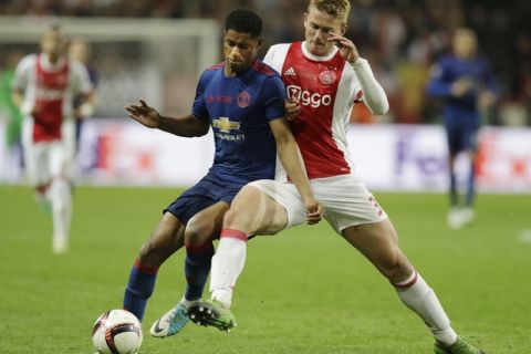 Manchester's Marcus Rashford, left, and Ajax's Matthijs de Ligt challenge for the ball during the soccer Europa League final between Ajax Amsterdam and Manchester United at the Friends Arena in Stockholm, Sweden, Wednesday, May 24, 2017. (AP Photo/Michael Sohn)