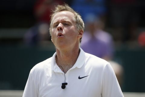 Patrick McEnroe plays in an exhibition doubles match at the International Tennis Hall of Fame Championship in Newport, R.I., Sunday, July 19, 2015. (AP Photo/Michael Dwyer)