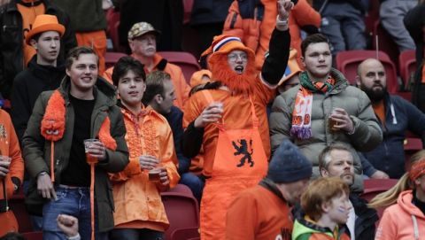 Spectators stand on the tribune in the area of supporters without a mask, prior to the start of the World Cup 2022 group G qualifying soccer match between The Netherlands and Latvia at the Johan Cruyff ArenA in Amsterdam, Netherlands, Saturday, March 27, 2021. (AP Photo/Peter Dejong)