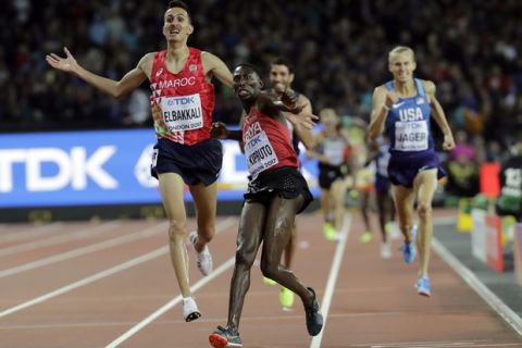 Kenya's Conseslus Kipruto celebrates winning the gold medal ahead of Morocco 's Soufiane Elbakkali and United States' Evan Jager in the Men's 3000m Steeplechase final during the World Athletics Championships in London Tuesday, Aug. 8, 2017. (AP Photo/David J. Phillip)