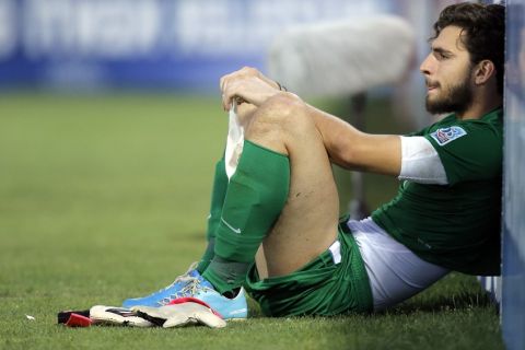 Greece goalkeeper Stefanos Kapino lies on the pitch  after the Under-20 World Cup round of 16 soccer match between Greece and Uzbekistan in Gaziantep, Turkey, Tuesday, July 2, 2013. Uzbekistan defeated Greece 3-1. (AP Photo/Vadim Ghirda)