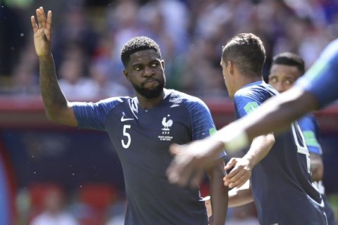 France's Samuel Umtiti reacts after playing a ball with the hand during the group C match between France and Australia at the 2018 soccer World Cup in the Kazan Arena in Kazan, Russia, Saturday, June 16, 2018. (AP Photo/David Vincent)
