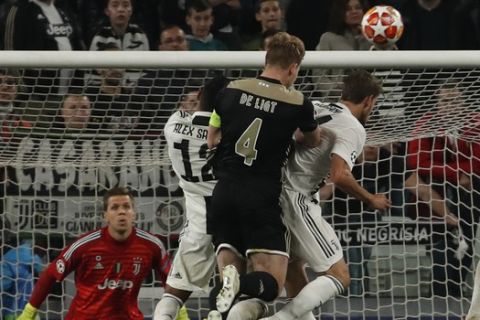 Ajax's Matthijs de Ligt, fourth from right, scores his side's second goal during the Champions League quarter final, second leg soccer match between Juventus and Ajax, at the Allianz stadium in Turin, Italy, Tuesday, April 16, 2019. (AP Photo/Antonio Calanni)