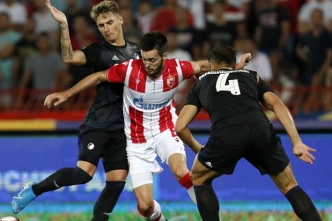 Red Star's Mirko Ivanic, center, duels for the ball with Copenhagen's Guillermo Varela, left, and Copenhagen's Sotirios Papagiannopoulos during the Champions League third qualifying round, first leg soccer match between Red Star and FC Copenhagen on the stadium Rajko Mitic in Belgrade, Serbia, Tuesday, Aug. 6, 2019. (AP Photo/Darko Vojinovic)