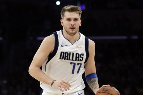Dallas Mavericks forward Luka Doncic (77) during the first half of an NBA basketball game against the Los Angeles Lakers Wednesday, Oct. 31, 2018, in Los Angeles. (AP Photo/Marcio Jose Sanchez)