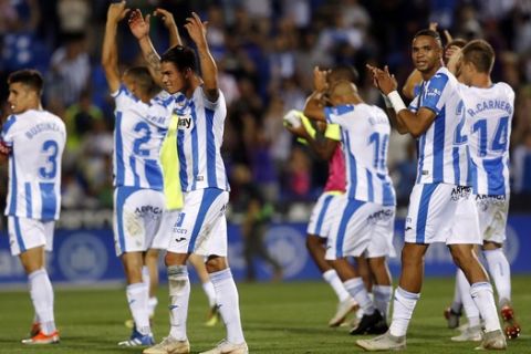 Leganes' players celebrate their victory over FC Barcelona after the Spanish La Liga soccer match between Leganes and FC Barcelona at the Butarque stadium in Leganes, Spain, Wednesday, Sept. 26, 2018. (AP Photo/Manu Fernandez)