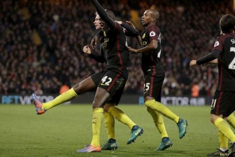 Manchester City's Yaya Toure, second left, celebrates scoring his side's second goal with Kevin De Bruyne, left, during the English Premier League soccer match between Crystal Palace and Manchester City at Selhurst Park stadium in London, Saturday, Nov. 19, 2016. (AP Photo/Matt Dunham)