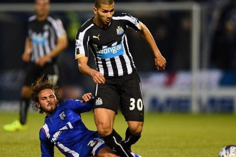 GILLINGHAM, UNITED KINGDOM - AUGUST 26:  Bradley Dack of Gillingham tackles Mehdi Abeid of Newcastle United during the Capital One Cup second round match between Gillingham and Newcastle United at Priestfield Stadium on August 26, 2014 in Gillingham, United Kingdom.  (Photo by Jamie McDonald/Getty Images)