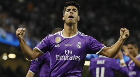 Real Madrid's Marco Asensio celebrates after scoring during the Champions League final soccer match between Juventus and Real Madrid at the Millennium Stadium in Cardiff, Wales, Saturday June 3, 2017. (AP Photo/Kirsty Wigglesworth)