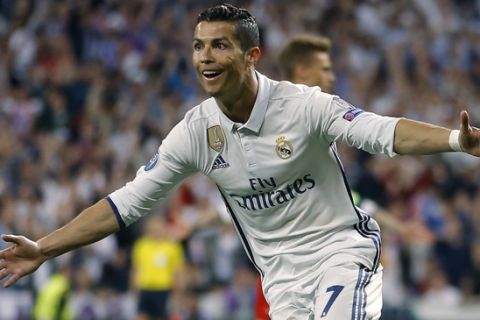 Real Madrid's Cristiano Ronaldo celebrates scoring during the Champions League quarterfinal second leg soccer match between Real Madrid and Bayern Munich at Santiago Bernabeu stadium in Madrid, Spain, Tuesday April 18, 2017. (AP Photo/Francisco Seco)