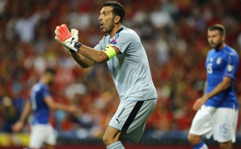 Italy goalkeeper Gianluigi Buffon gestures during the World Cup Group G qualifying soccer match between Spain and Italy at the Santiago Bernabeu Stadium in Madrid, Saturday Sept. 2, 2017. (AP Photo/Paul White)