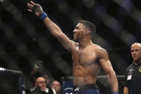 Kevin Lee celebrates his win over Edson Barboza after their fight was stopped in the fourth round of their mixed martial arts featherweight bout, early Sunday, April 22, 2018, in Atlantic City, N.J. (AP Photo/Mel Evans)