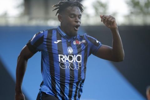 Atalanta's Duvan Zapata celebrates after scoring his side's fourth goal during the Serie A soccer match between Atalanta and Sassuolo at the Gewiss Stadium in Bergamo, Italy, Sunday, June 21, 2020. Atalanta is playing its first match in Bergamo since easing of lockdown measures, in the area that has been the epicenter of the hardest-hit province of Italy's hardest-hit region, Lombardy, the site of hundreds of COVID-19 deaths. (AP Photo/Luca Bruno)