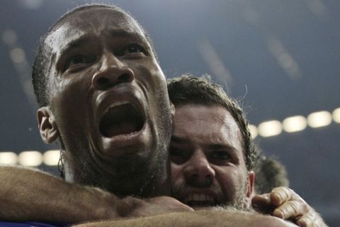 Chelsea's Didier Drogba celebrates with teammate Juan Mata after scoring during the Champions League final soccer match between Bayern Munich and Chelsea in Munich, Germany Saturday May 19, 2012. (AP Photo/Frank Augstein)