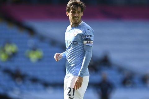 Manchester City's David Silva walks on the pitch during the English Premier League soccer match between Manchester City and Norwich City at the Etihad Stadium in Manchester, England, Sunday, July 26, 2020. (Shaun Botterill/Pool via AP)