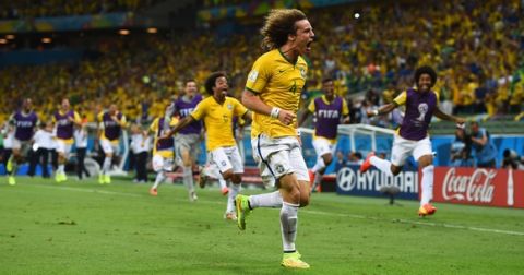 FORTALEZA, BRAZIL - JULY 04:  David Luiz of Brazil celebrates scoring his team's second goal during the 2014 FIFA World Cup Brazil Quarter Final match between Brazil and Colombia at Castelao on July 4, 2014 in Fortaleza, Brazil.  (Photo by Laurence Griffiths/Getty Images)