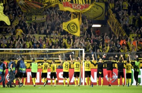 Dortmund players celebrate with their fans after playing 2-2 during the Champions League group F soccer match between Borussia Dortmund and Real Madrid in Dortmund, Germany, Tuesday, Sept. 27, 2016. (AP Photo/Martin Meissner) 